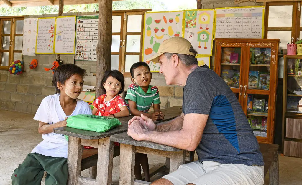 Chris Kingsley, founder of the Lampi Foundation with local children at school