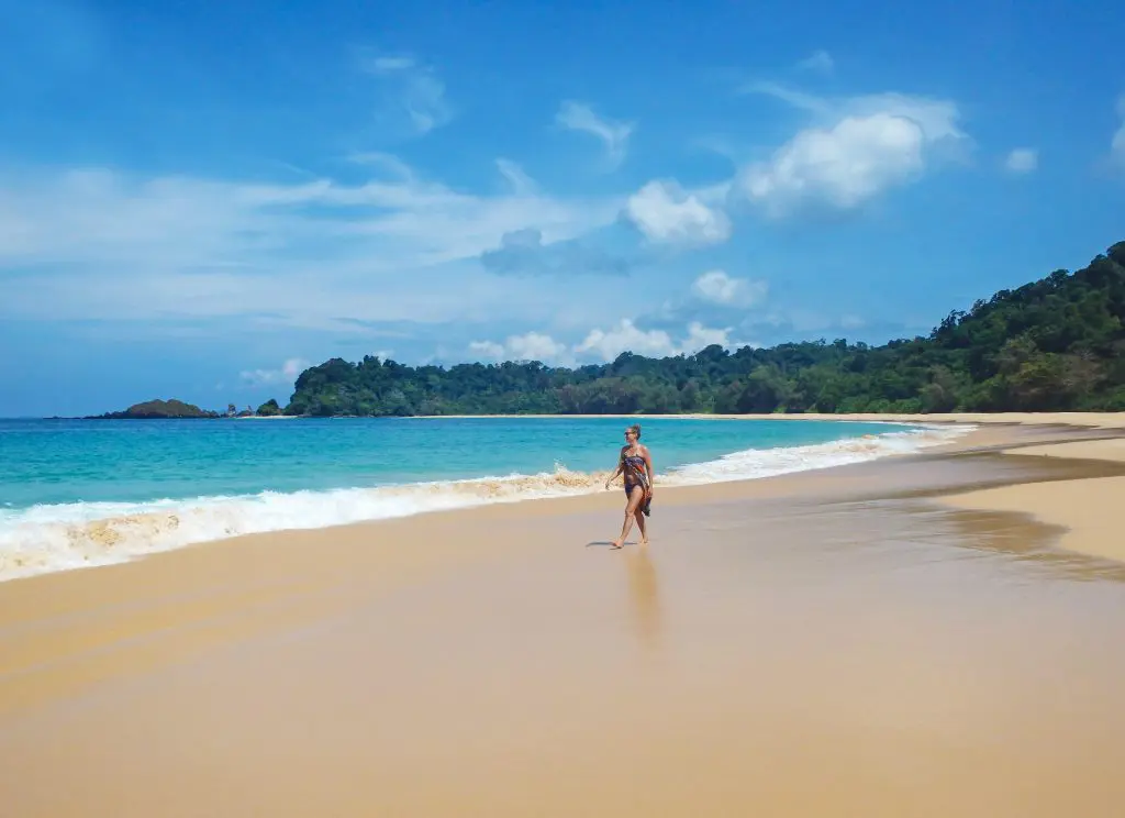 Female guest enjoys walking on the beautiful beaches of Wa Ale